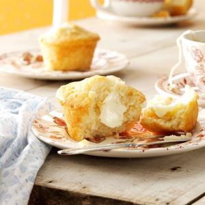 Honey muffins wight some butter on them.