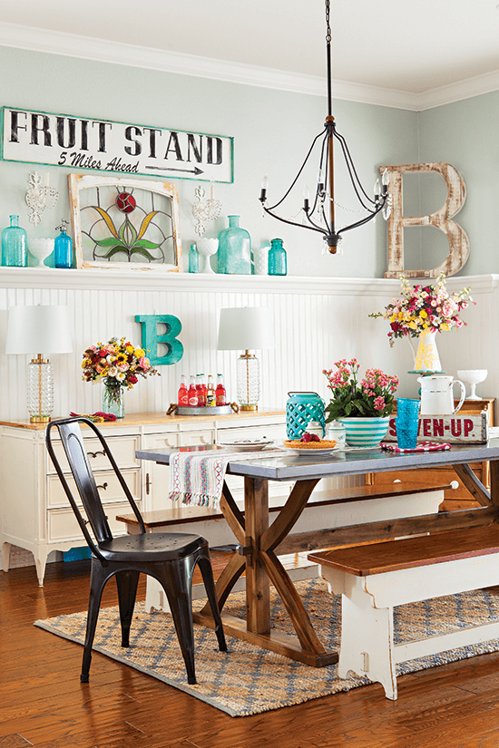 Light and bright dining room with mixed and matched treasures all around, accented with wood and teal glass. 