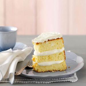 A sponge cake with cream filing in between each layer.