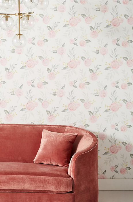 floral wallpaper, modern gold light fixture and blush velvet couch