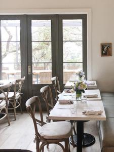 Light and bright diner with cheerful florals on the tables.