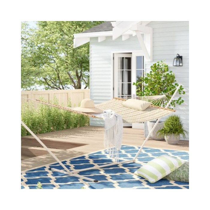 patio with blue and green accents and white hammock