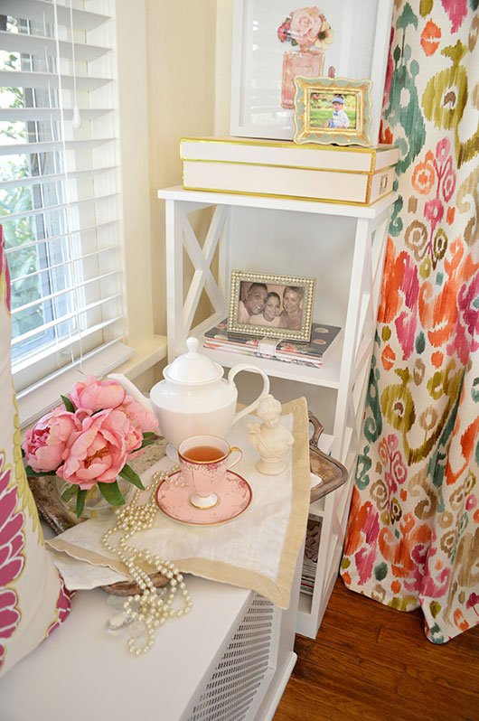 small shelving unit styled with books and art