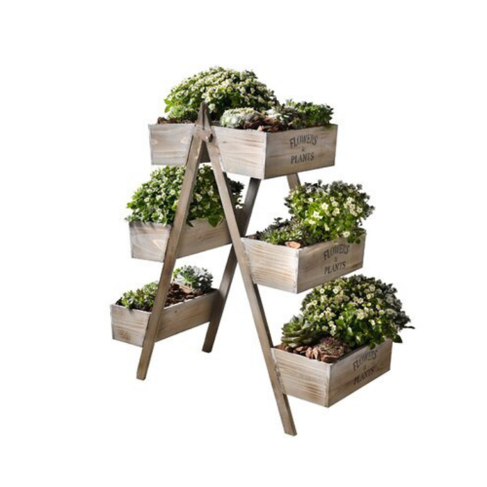 wooden layered planter boxes filled with green plants