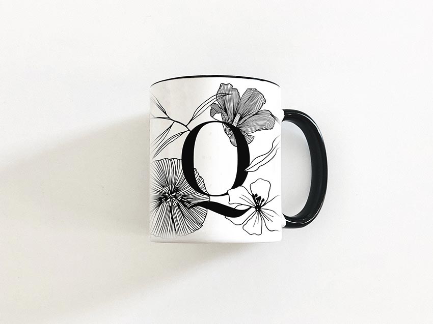 Q monogram mug with black line drawing flowers
