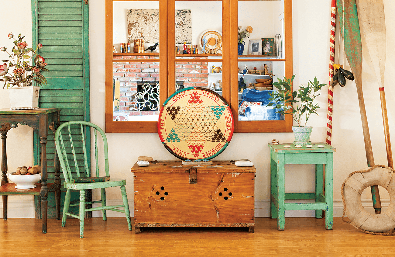 old game boards, shutters and sports equipment used as wall art