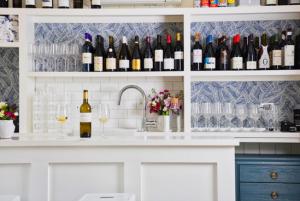 Custom bar lined with bottles and glassware.
