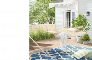 Patio with blue and green accents featuring white hammock