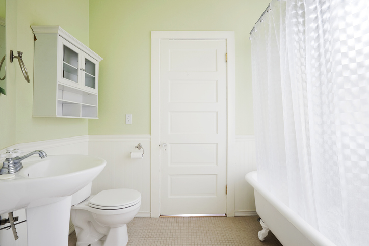 Cute green and white bathroom.