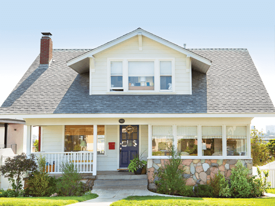 beach cottage with stonework facade.