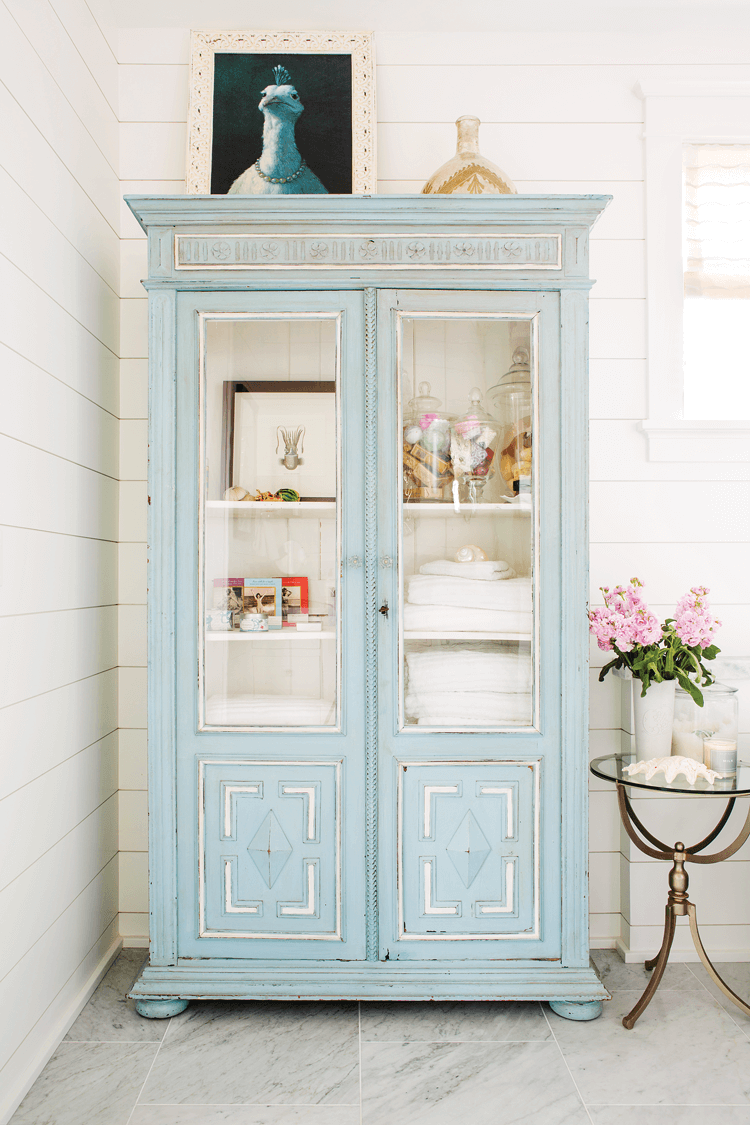 corner of master bath in beach farmhouse featuring a european style blue cabin