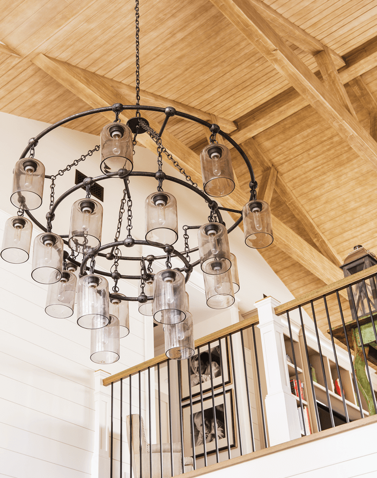 rustic farmhouse chandelier hanging from a vaulted ceiling