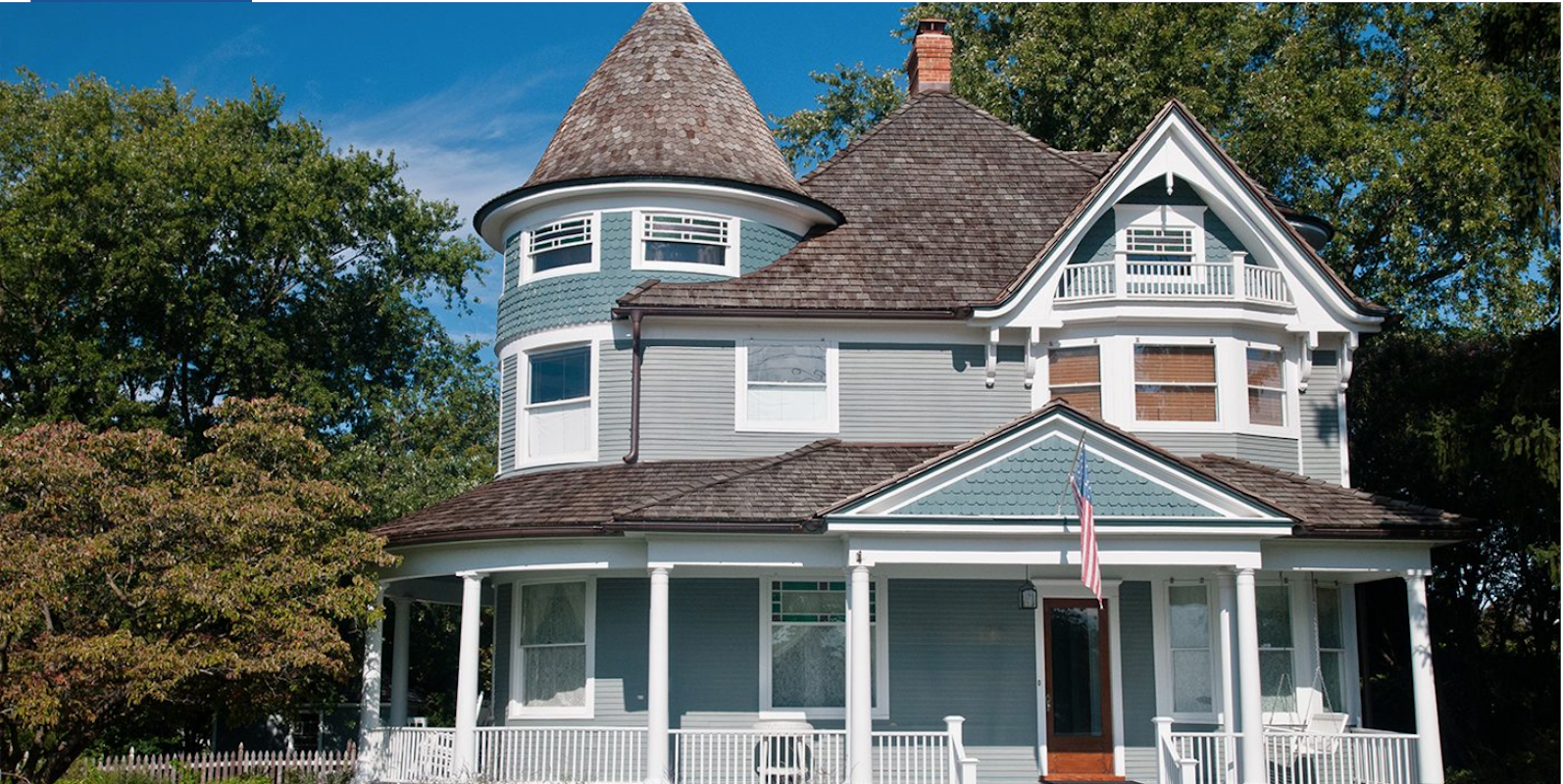 A blue victorian-style home.