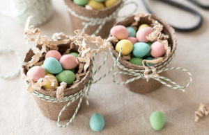 Small buckets filled with candy eggs and wrapped in twine.