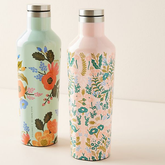 Two stainless steel water bottles with colorful floral design. 