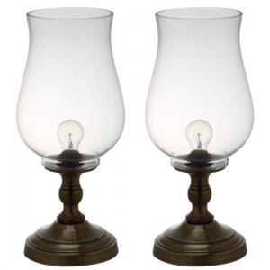 Two hurricane lamps for a bedside table, bronze bottoms and glass hurricane shaped tops.