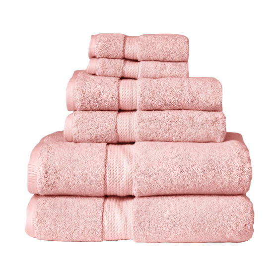 Stack of blush colored bathroom towels.