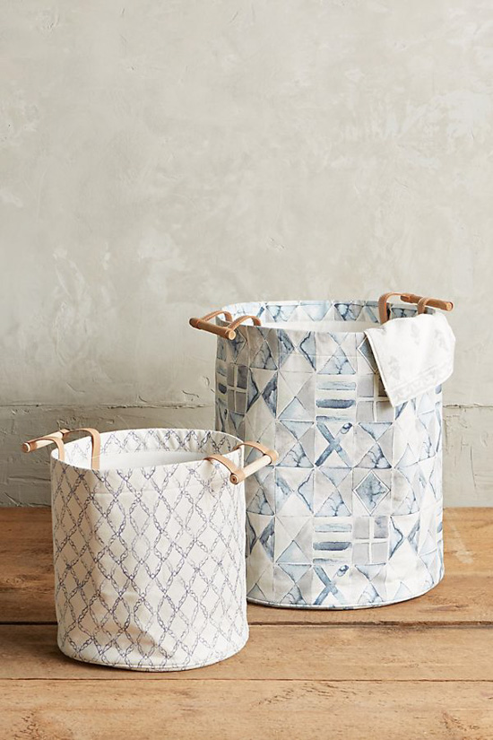 Set of two watercolored light shades of blue hampers in two different sizes.