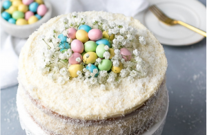 coconut cake with babys breath and candy eggs