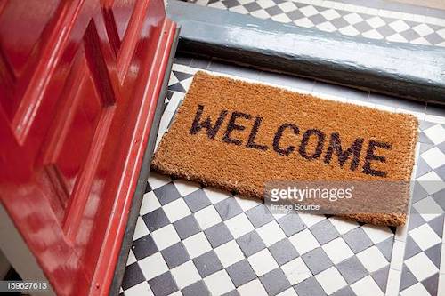 A doormat that says "welcome".