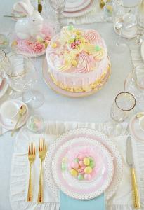elegant table with easter cake and pretty china