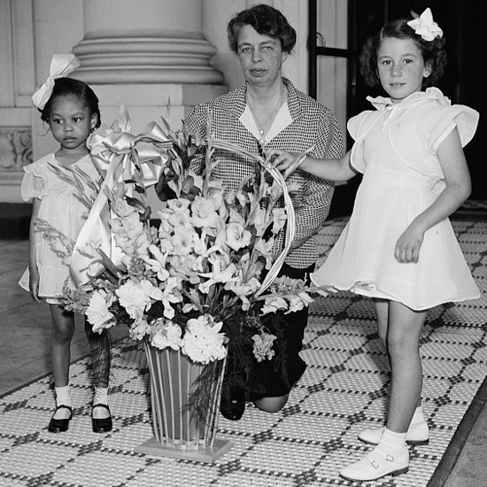 Eleanor Roosevelt and some young girls that delivered a May Day Basket to the White Houe.