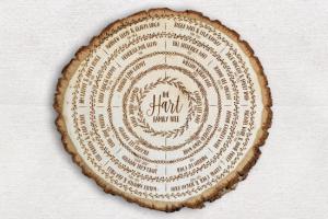 Wood slice with family tree names written in cursive on the rings