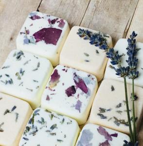 Set of 12 cube shaped bath bombs filled with pieces of fresh lavender.