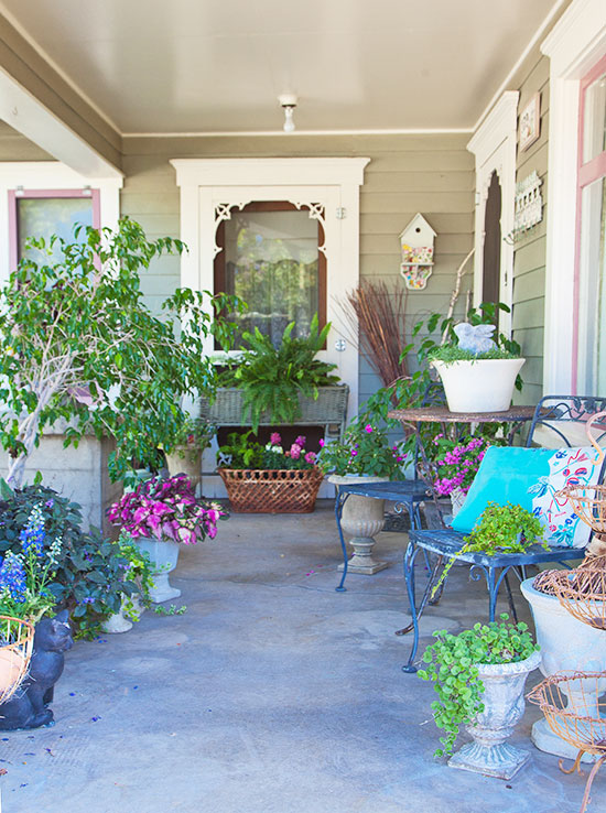 Creative containers make the porch garden a whimsical and colorful space.