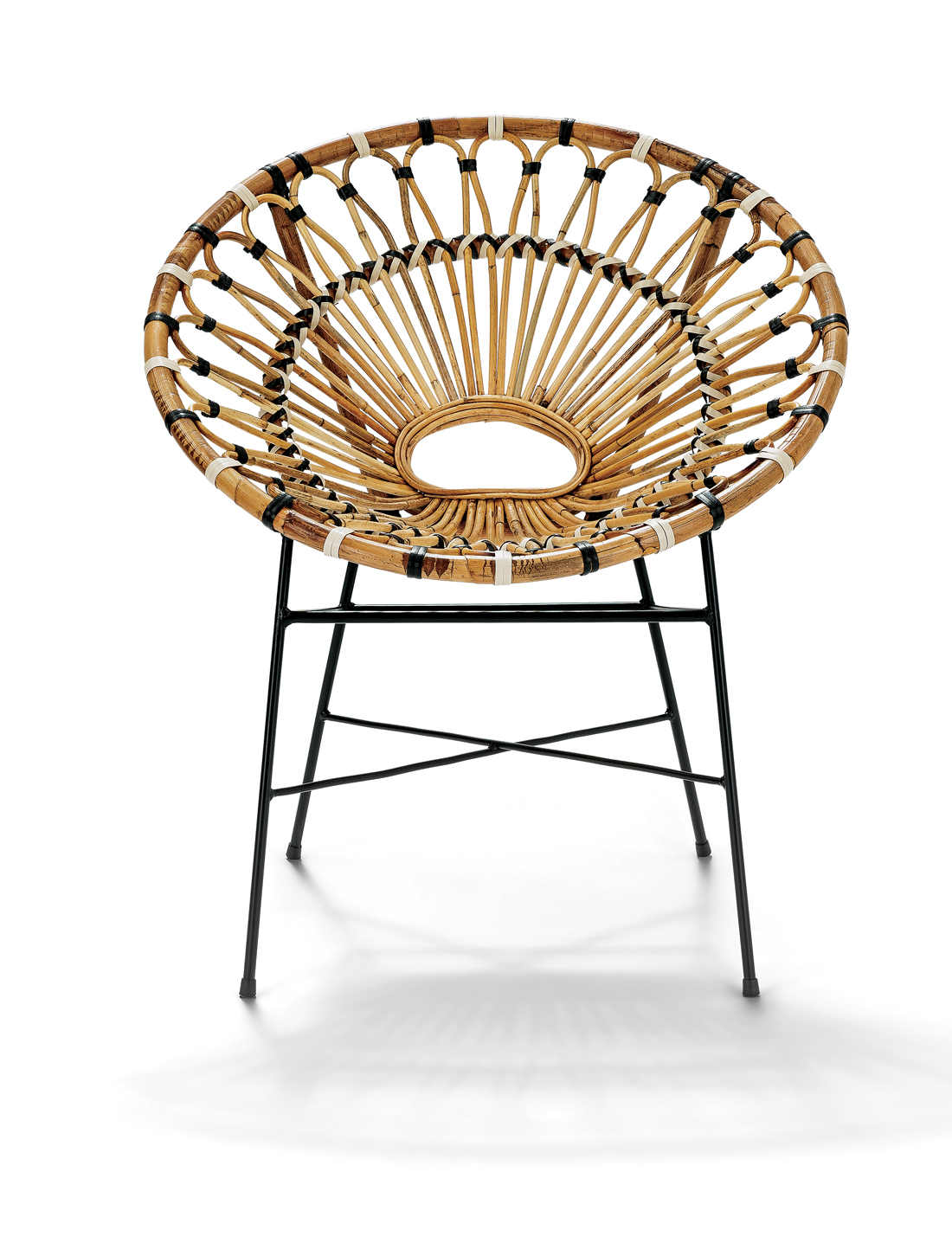 Rattan Chair on black metal legs with black and white accents.