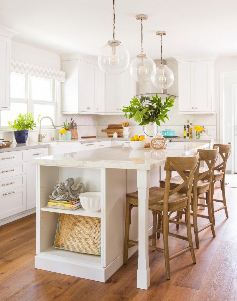 white cottage kitchen with open shelving on a white marble island