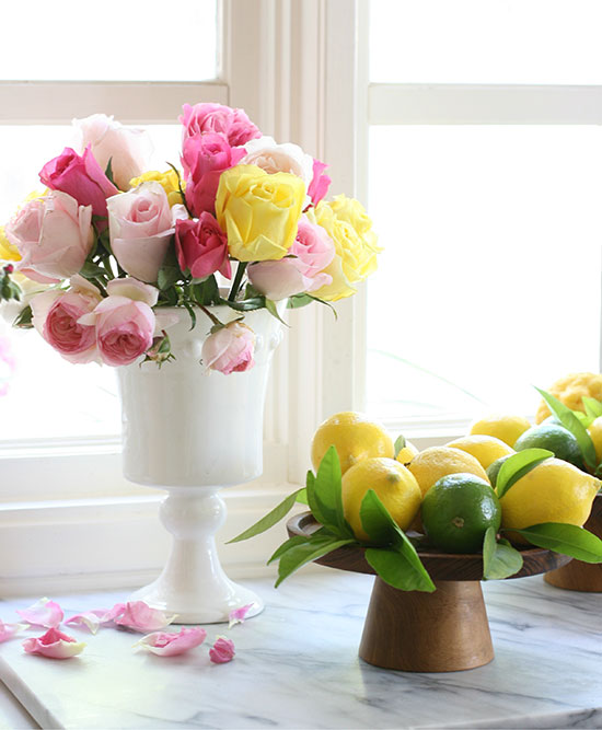 colorful roses in an milk glass vae