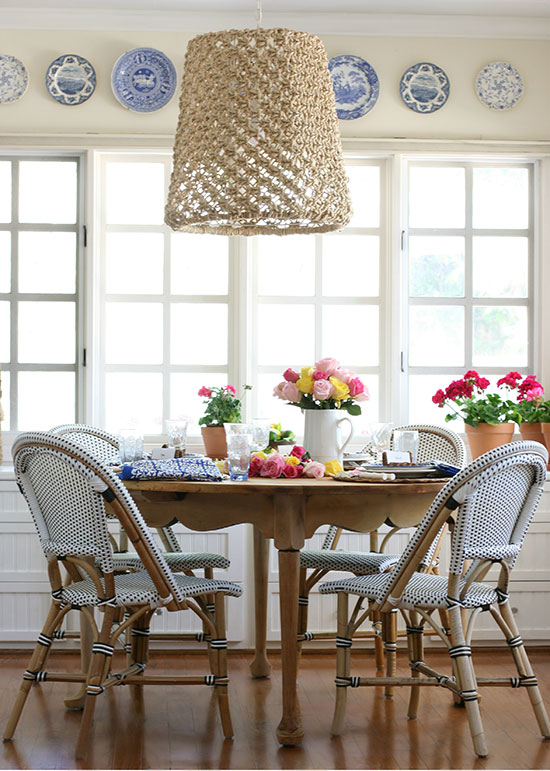 garden inspired french country table with wicker bistro chairs and rattan chargers