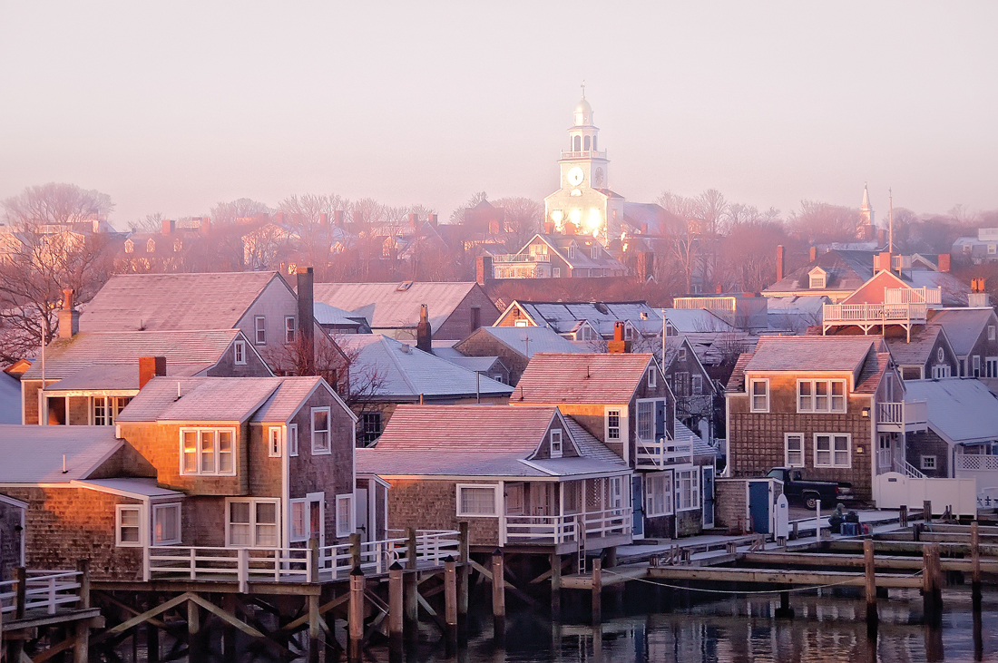 Nantucket docks and rooftops at sunrise. 