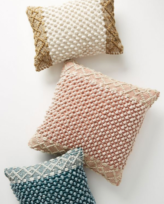 three bohemian designed throw pillows