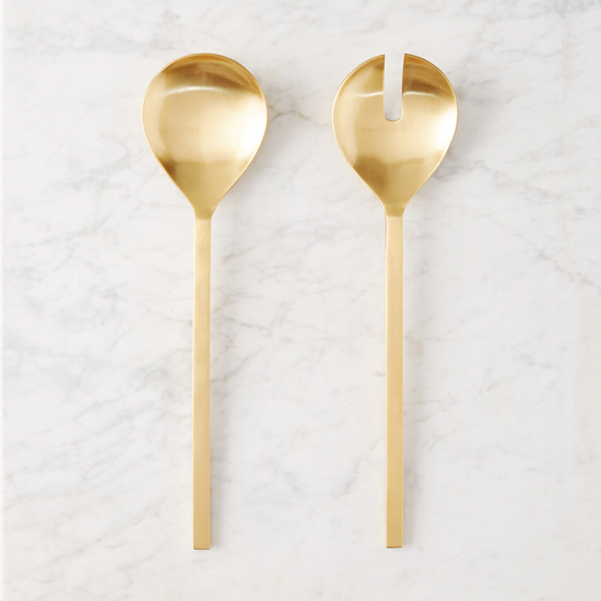 Marbled backdrop with gold salad tongs