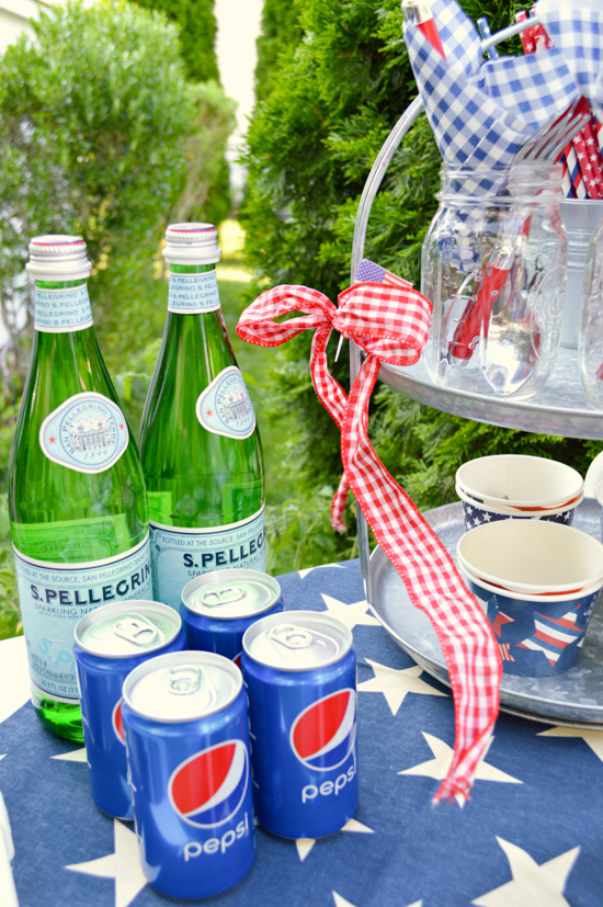 Beverages set out on a 4th of July themed side table. 