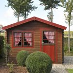 Wooden pine shed with curtains in the back yard