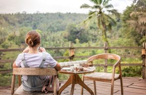 woman siting outside on a deck