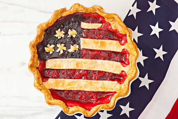 A berry pie is topped with crust arranged like an American flag 