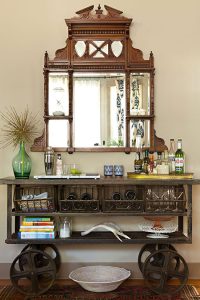 antique mirror with an industrial cart to create a striking sideboard