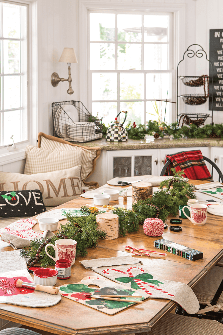 DIY Christmas stockings decorating party on a table with Christmas decorations