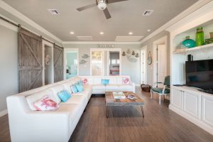 white couches with beach decor