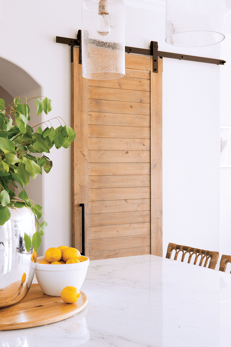 A custom made sliding barn door, crafted out of wood. 