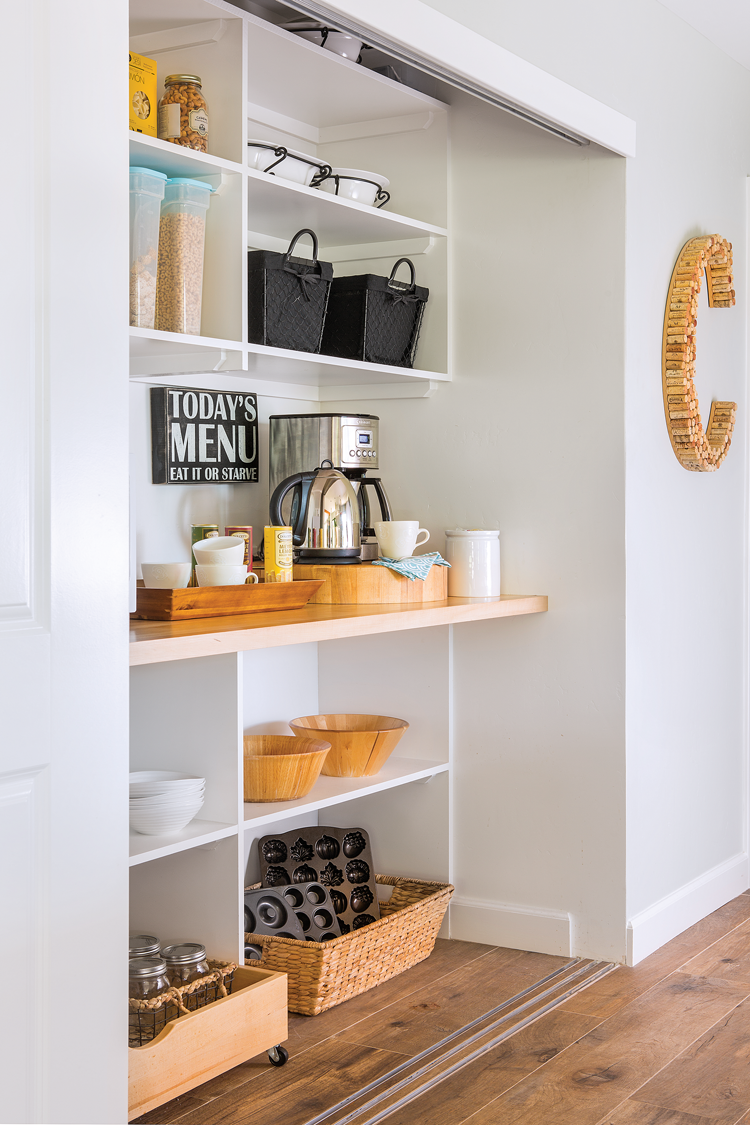 Clean and clutter-free coffee nook with open shelving and everything in it's place. 