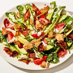 lettuce with tomato and bacon in a bowl