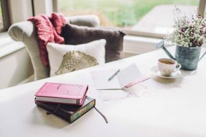 books on top of a white desk