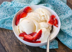 vanilla ice cream topped with strawberries
