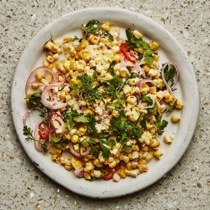 charred and raw corn mixed on a plate