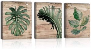 beach wall art consisting of three panels of different green palm leafs set against a wood plank background